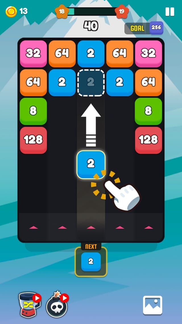 A snowy theme board where a blue 2 block travels up the lane toward the 2 sitting in the second row.