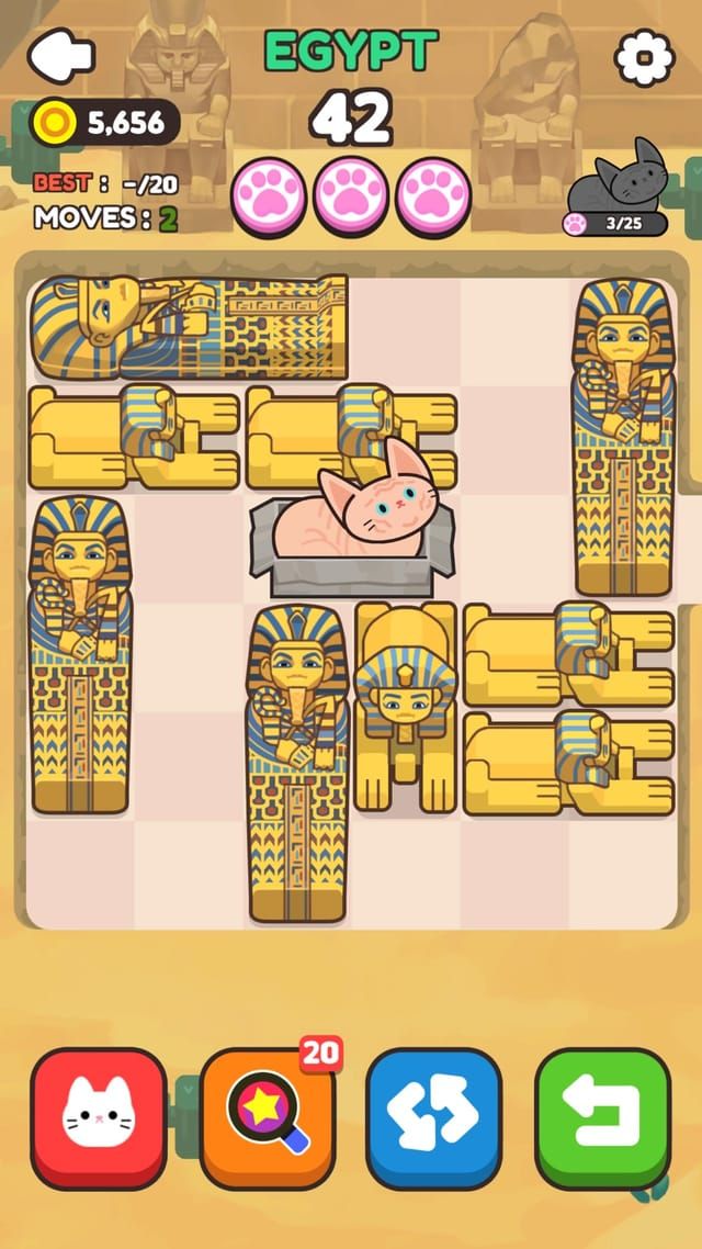 An Egypt stage where sarcophagus and pharaoh blocks crowd the board around a pink cat in the middle.