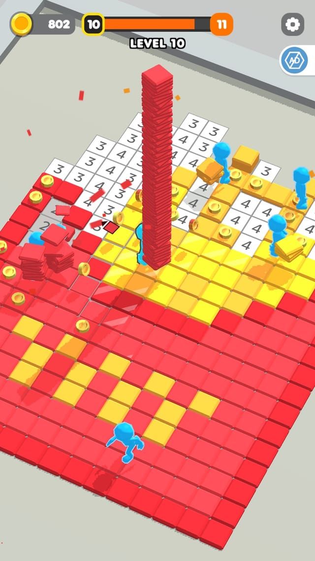 A tall column of red tiles being carried across a board where the red and yellow sections are already down.
