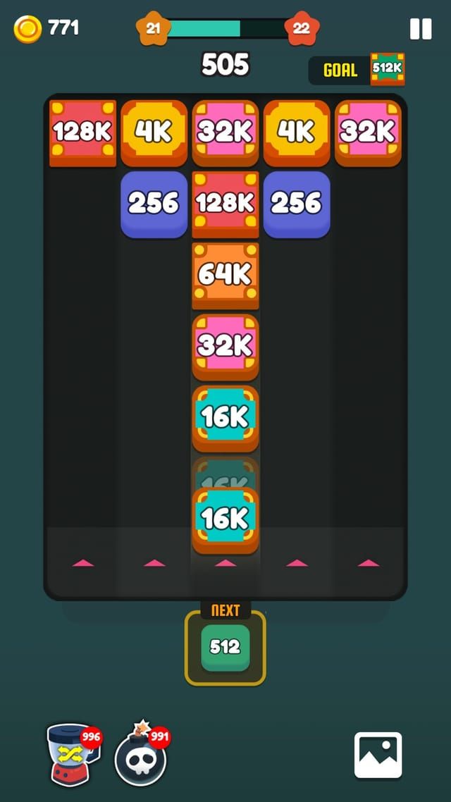 A late board where merging has pushed the numbers to 16K, 32K, 64K and 128K under a goal of 512K.