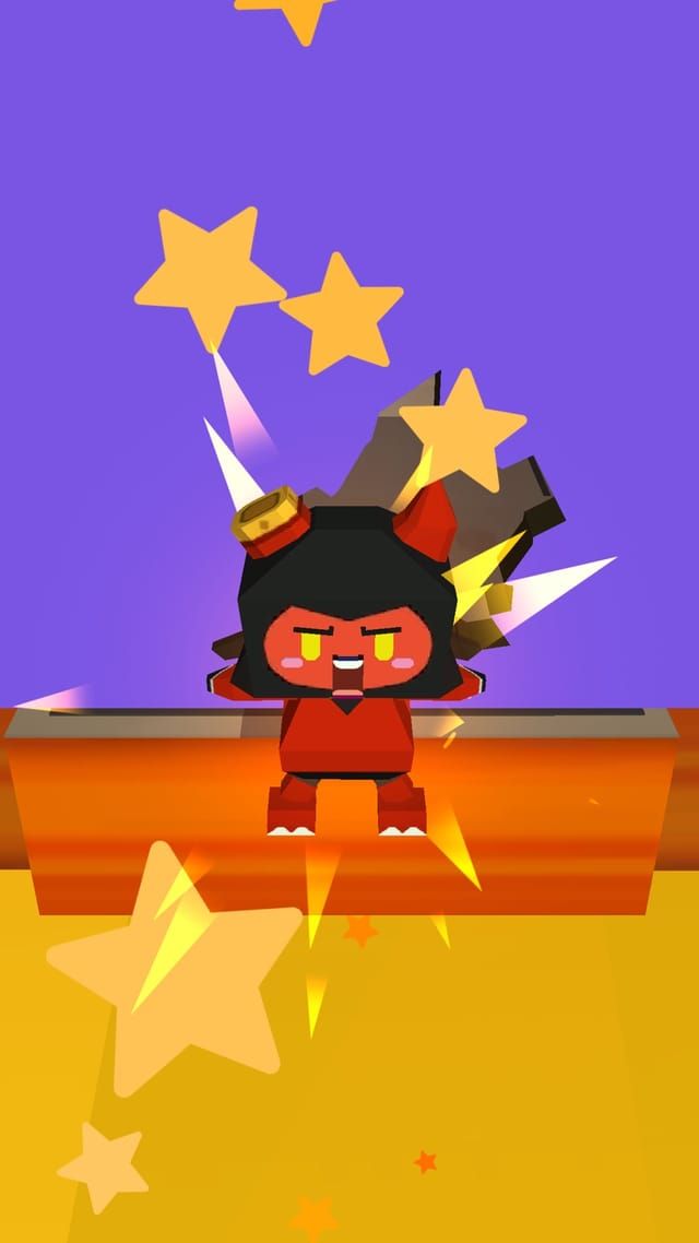 A red devil character celebrates a cleared wall with gold stars bursting around the platform.