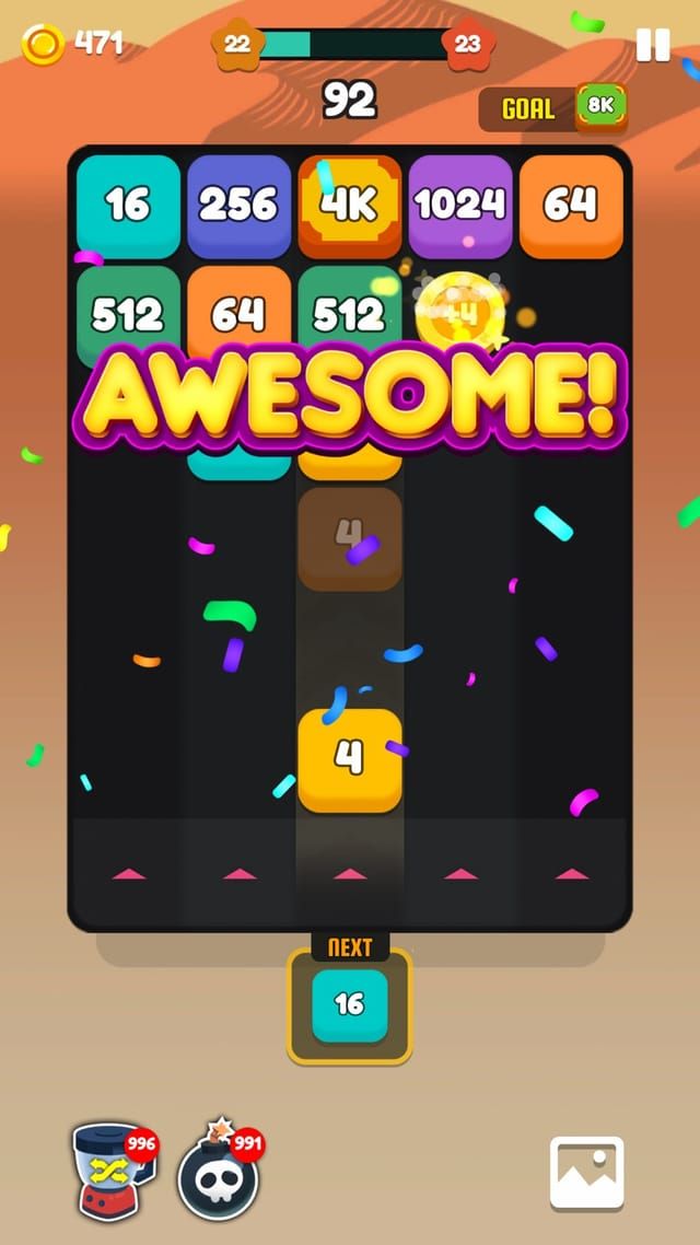 A desert theme board with an AWESOME! banner and confetti after a chain of merges resolves.